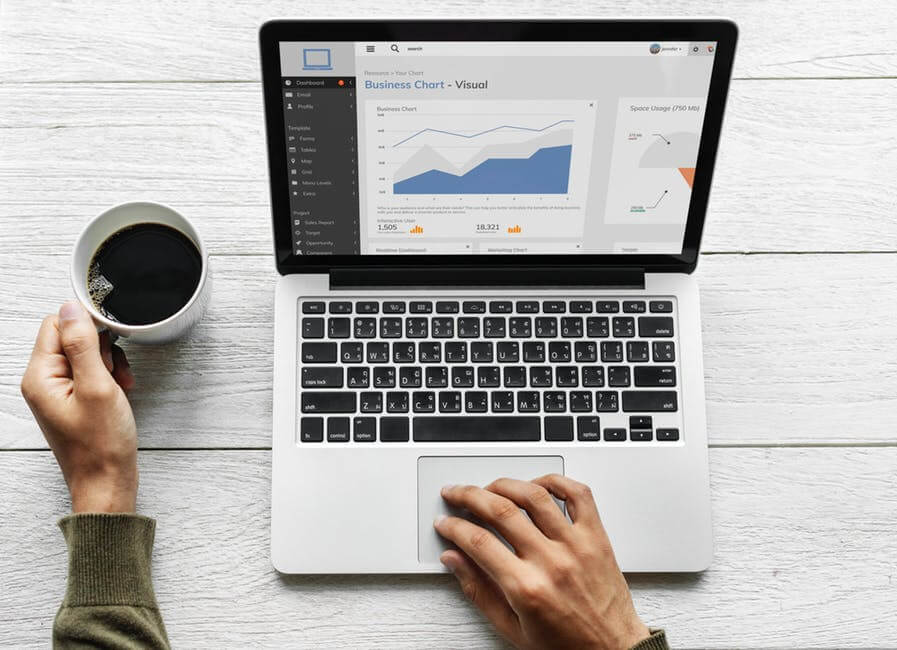 Marketing Consultant in computer visualizing metrics for strategies